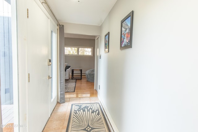 corridor with light tile patterned flooring
