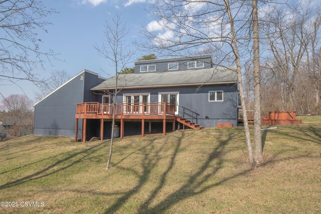 back of house with a wooden deck, stairway, and a lawn