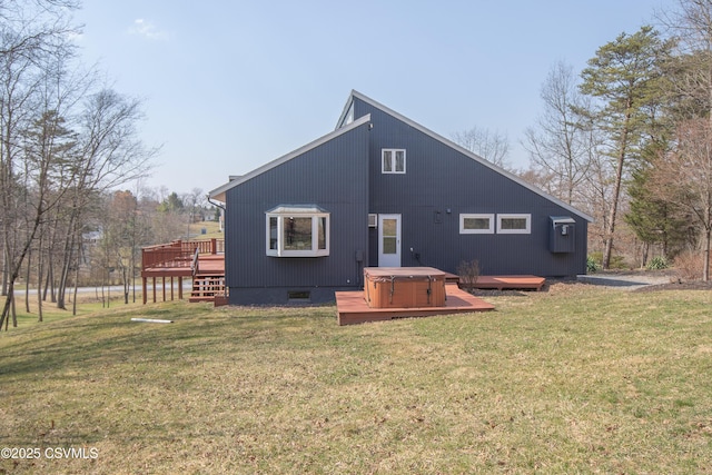 back of property with crawl space, a yard, a deck, and a hot tub