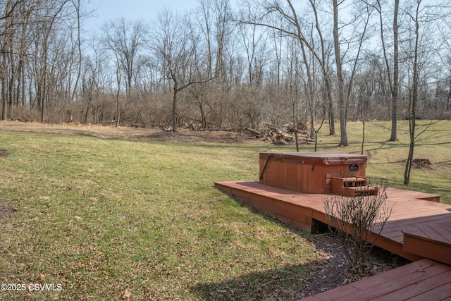 view of yard with a wooden deck and a hot tub