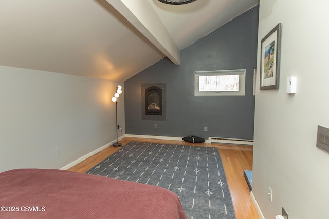 bedroom with a baseboard radiator, wood finished floors, lofted ceiling with beams, and baseboards