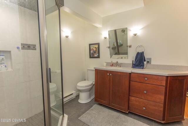 bathroom featuring toilet, baseboard heating, a shower stall, vanity, and tile patterned floors