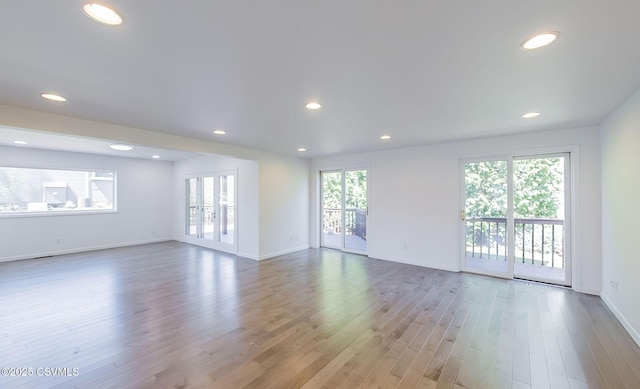 87 Lindsey Ave, Danville, PA 17821 - unfurnished living room with wood finished floors, plenty of natural light, and recessed lighting