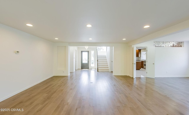 87 Lindsey Ave, Danville, PA 17821 - unfurnished living room featuring recessed lighting, stairway, light wood-type flooring, and baseboards