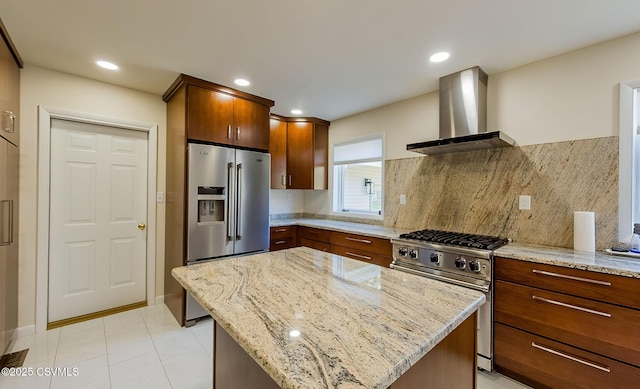 87 Lindsey Ave, Danville, PA 17821 - kitchen featuring wall chimney range hood, a kitchen island, light stone countertops, decorative backsplash, and appliances with stainless steel finishes