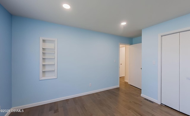 87 Lindsey Ave, Danville, PA 17821 - unfurnished bedroom featuring a closet, baseboards, recessed lighting, visible vents, and wood finished floors