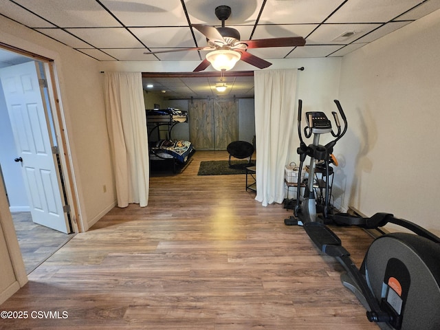 444 Frederick Dr, Watsontown, PA 17777 - exercise room featuring baseboards, ceiling fan, a drop ceiling, and wood finished floors