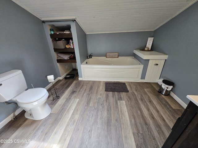 444 Frederick Dr, Watsontown, PA 17777 - full bath with wood finished floors, lofted ceiling, toilet, baseboards, and a bath