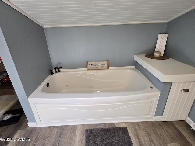444 Frederick Dr, Watsontown, PA 17777 - bathroom with a whirlpool tub and wood finished floors
