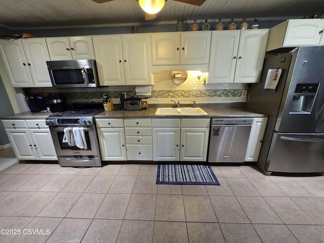 444 Frederick Dr, Watsontown, PA 17777 - kitchen with a sink, appliances with stainless steel finishes, tasteful backsplash, and dark countertops