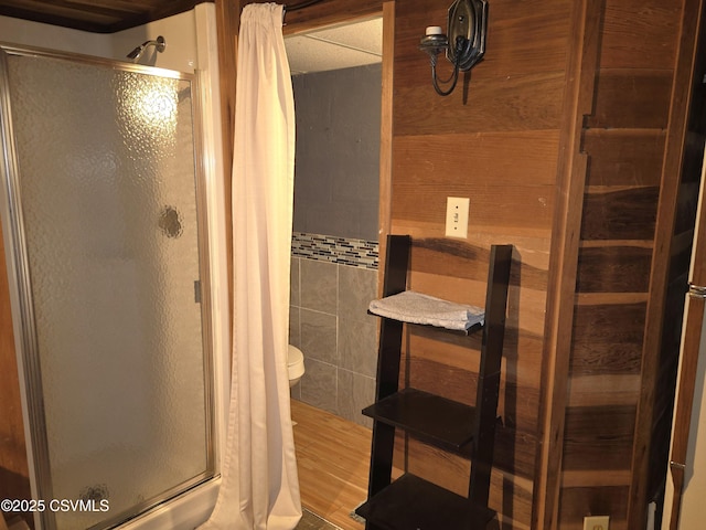 444 Frederick Dr, Watsontown, PA 17777 - bathroom featuring tile walls, toilet, and a shower stall