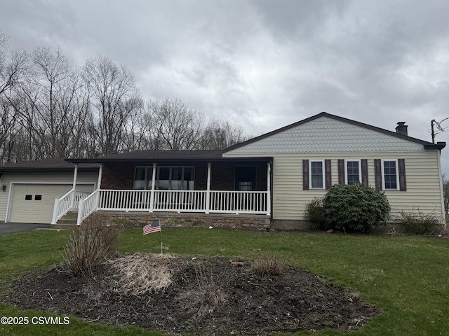 73 Seneca Dr, Shickshinny, PA 18655 - ranch-style home featuring a porch, driveway, a front yard, and a garage