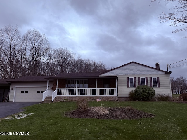 73 Seneca Dr, Shickshinny, PA 18655 - single story home featuring a chimney, driveway, a porch, a front yard, and a garage