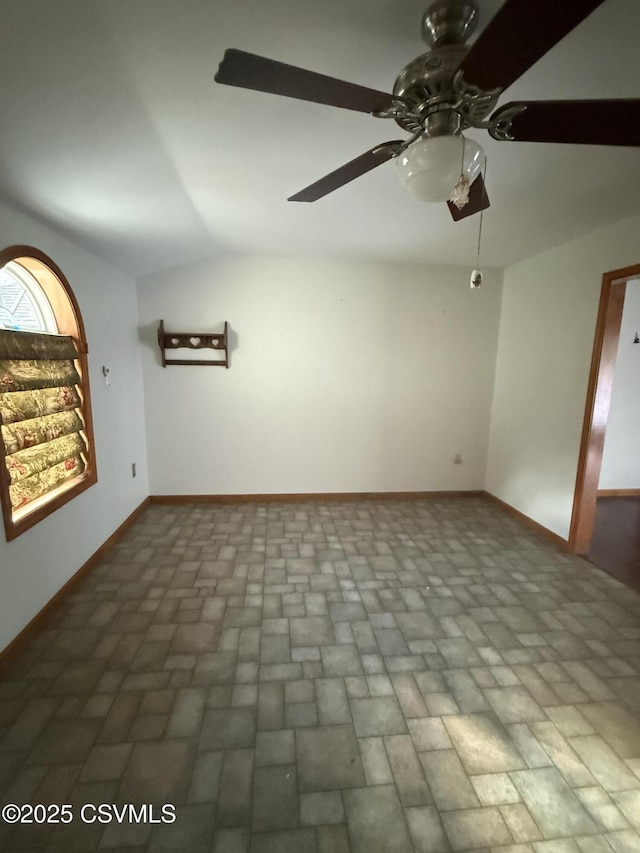 73 Seneca Dr, Shickshinny, PA 18655 - empty room with vaulted ceiling, baseboards, brick patterned floor, and ceiling fan