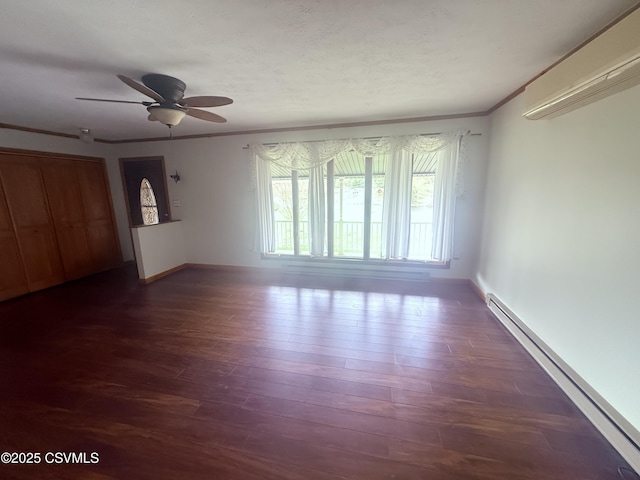73 Seneca Dr, Shickshinny, PA 18655 - interior space with baseboard heating, crown molding, ceiling fan, baseboards, and dark wood-style flooring