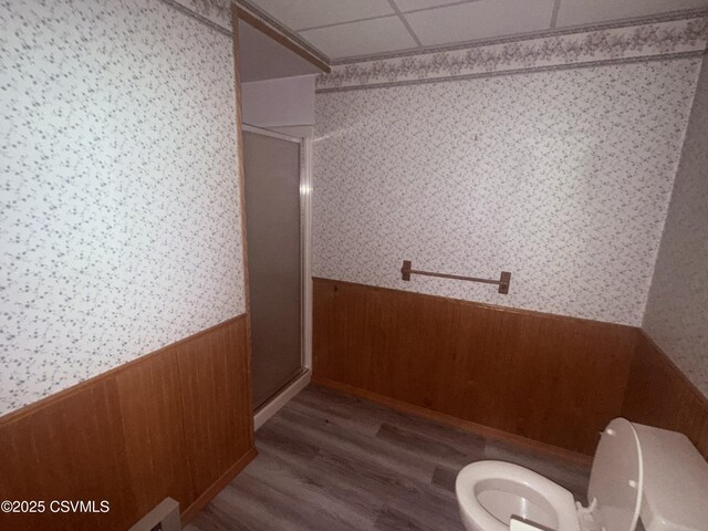 73 Seneca Dr, Shickshinny, PA 18655 - bathroom with wood walls, wallpapered walls, a stall shower, wainscoting, and toilet