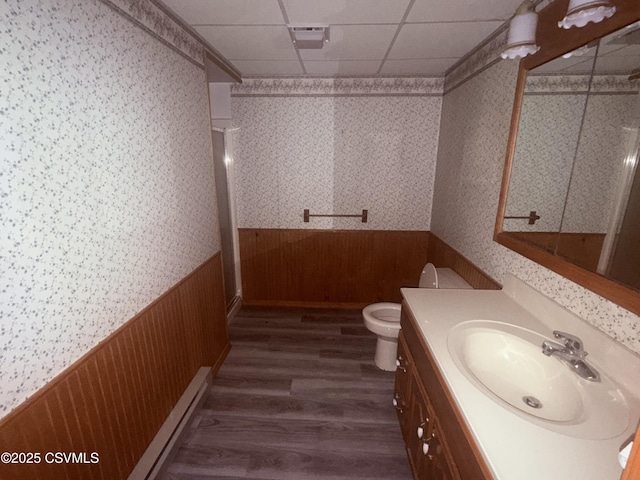 73 Seneca Dr, Shickshinny, PA 18655 - bathroom featuring a wainscoted wall, toilet, wallpapered walls, wood finished floors, and vanity