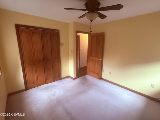 73 Seneca Dr, Shickshinny, PA 18655 - unfurnished bedroom featuring light carpet, baseboards, a closet, and ceiling fan