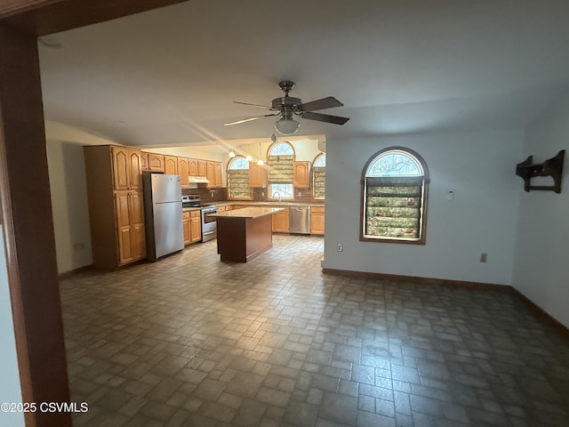 73 Seneca Dr, Shickshinny, PA 18655 - kitchen with a sink, baseboards, appliances with stainless steel finishes, brick patterned floor, and a kitchen island