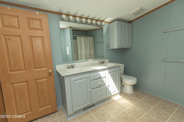 full bathroom featuring a sink, toilet, double vanity, and visible vents