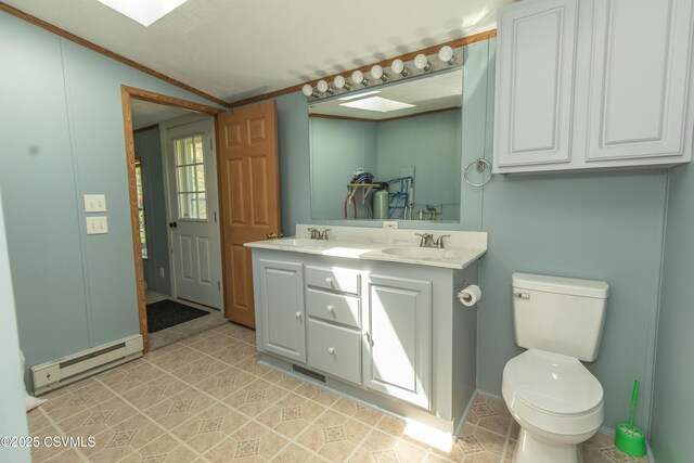 full bathroom with a baseboard radiator, a sink, and toilet