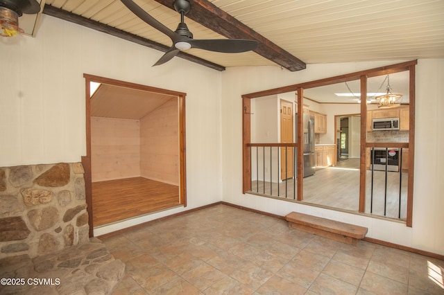 unfurnished sunroom featuring beamed ceiling