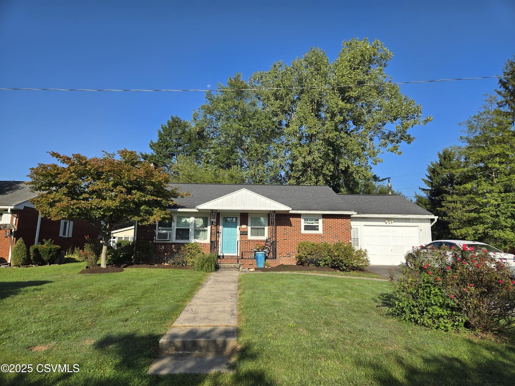 view of front facade featuring a front lawn, brick siding, and an attached garage