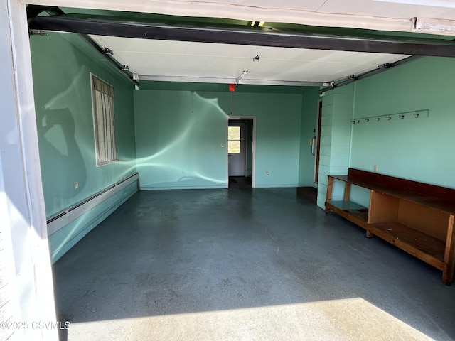 garage with a baseboard heating unit