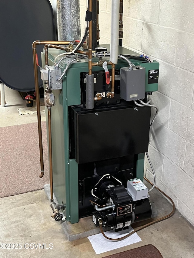 utility room featuring a heating unit