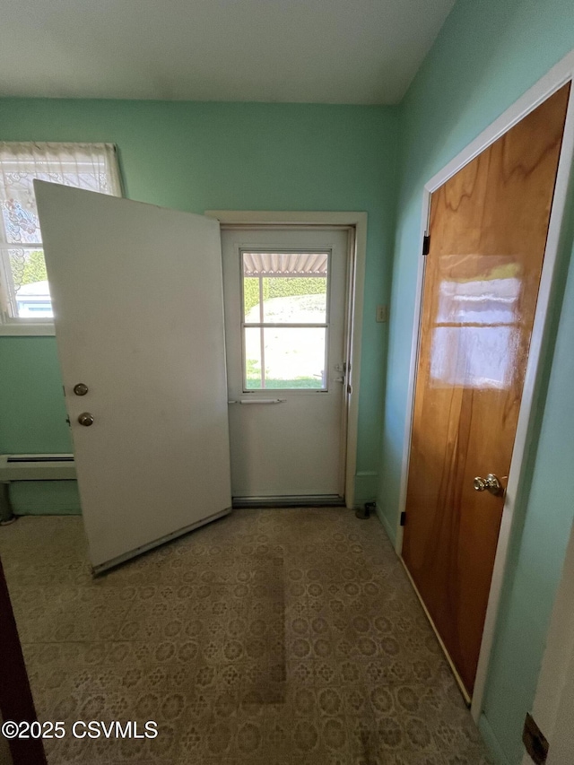 doorway with baseboard heating