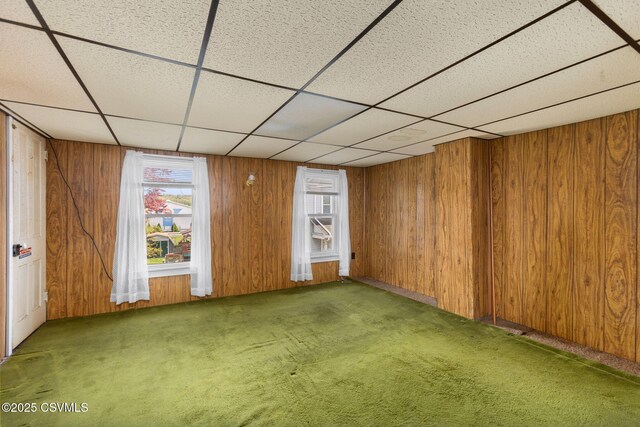 1205 N River Ave, Sunbury, PA 17801 - carpeted empty room featuring wooden walls and a drop ceiling