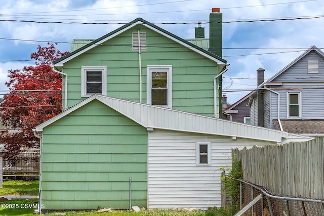 1205 N River Ave, Sunbury, PA 17801 - view of home's exterior featuring fence and a chimney