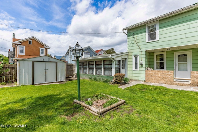 1205 N River Ave, Sunbury, PA 17801 - view of yard featuring a shed, a sunroom, and an outbuilding