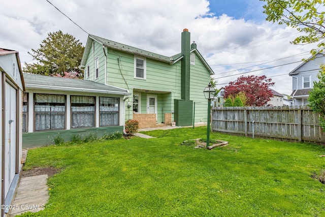 1205 N River Ave, Sunbury, PA 17801 - back of house with a chimney and brick siding