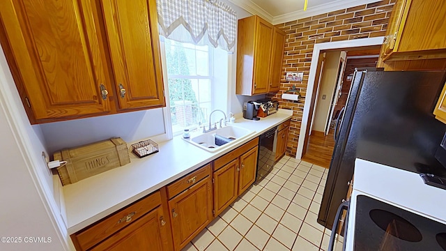 kitchen with a sink, black appliances, ornamental molding, light tile patterned flooring, and brown cabinets