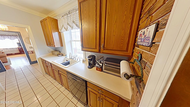 kitchen featuring a sink, dishwasher, ornamental molding, light countertops, and light tile patterned flooring