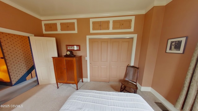 bedroom featuring light carpet, ornamental molding, a closet, and baseboards