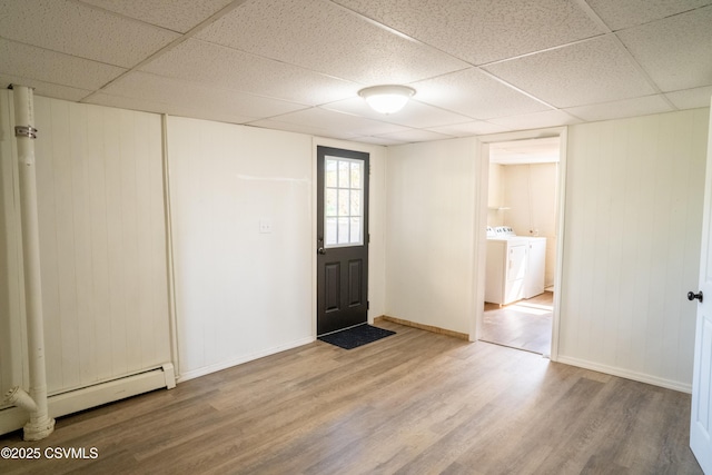 302 Walnut St, Selinsgrove, PA 17870 - foyer entrance with a baseboard heating unit, a drop ceiling, wood finished floors, and washer and clothes dryer
