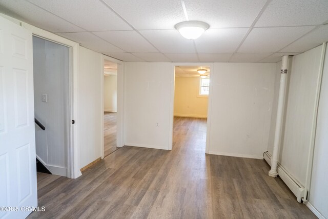 302 Walnut St, Selinsgrove, PA 17870 - interior space with baseboards, a drop ceiling, wood finished floors, and a baseboard radiator