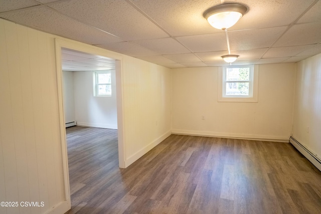 302 Walnut St, Selinsgrove, PA 17870 - below grade area featuring wood finished floors, a paneled ceiling, and baseboard heating