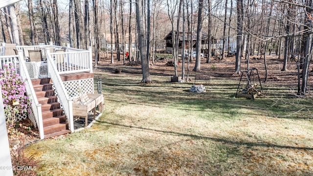 view of yard with a deck and stairway