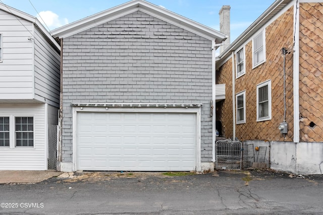exterior space featuring a garage and central AC unit