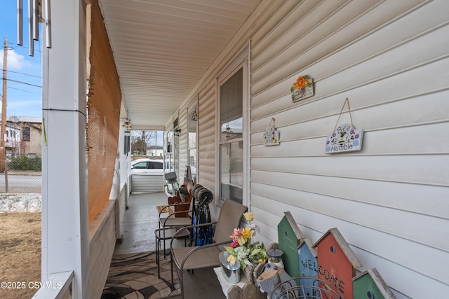 view of patio with fence and covered porch
