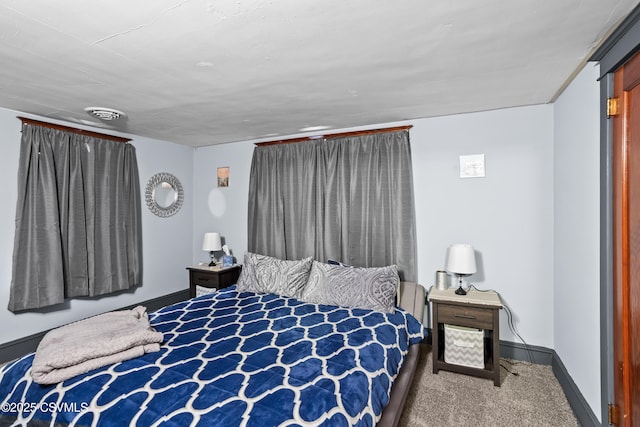 bedroom featuring visible vents, carpet flooring, and baseboards