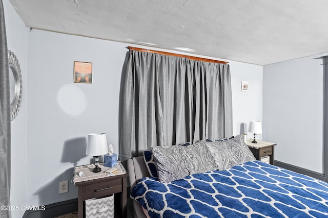 bedroom featuring baseboards