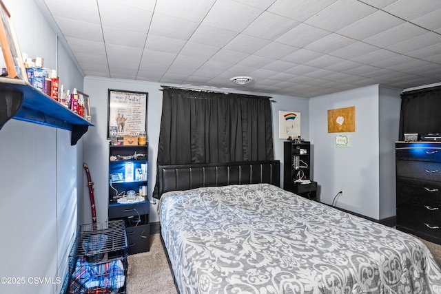 carpeted bedroom featuring crown molding