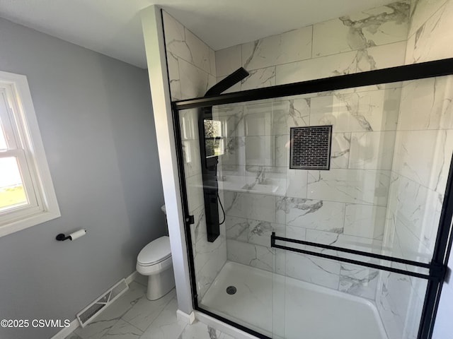 full bathroom with visible vents, marble finish floor, toilet, baseboards, and a stall shower