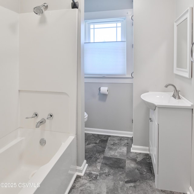 bathroom featuring vanity, baseboards, shower / bathtub combination, and toilet