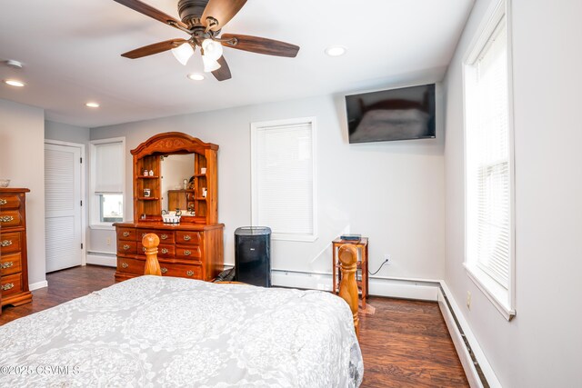 bedroom featuring dark wood-type flooring, recessed lighting, and baseboard heating