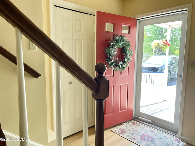 entryway with light wood-style flooring and stairway